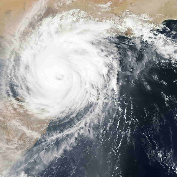 Satellite image of a swirling, symmetrical hurricane with a clear eye at the center from the Microsoft Planetary Computer.