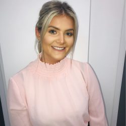 Headshot of Lily Mears, young girl with blonde hair, smiling at the camera