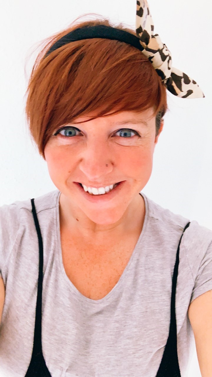 Kelly McGurk, a woman who is smiling and looking at the camera