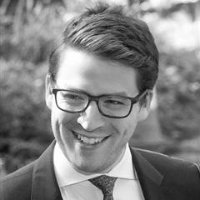 Nick Hedderman wearing a suit and tie