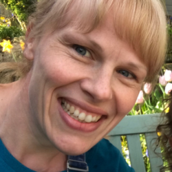 Headshot of Sam Pywell smiling at the camera