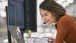 A woman looking at a computer screen