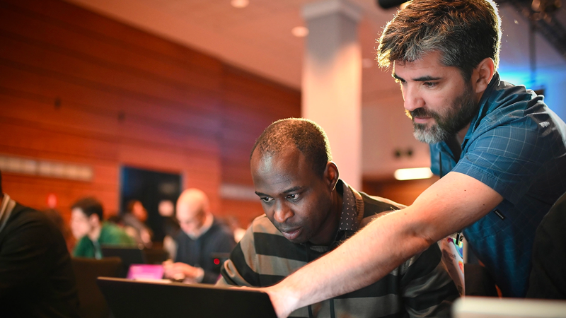 A man looking at a laptop