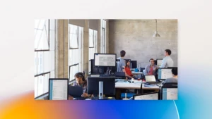 a person sitting at a desk with a computer
