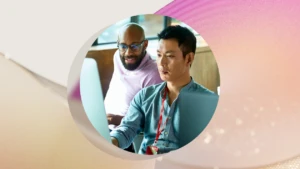 A group of men looking at a computer screen