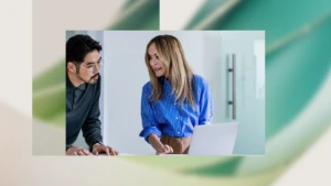 Electric car engineers collaborating in factory office.