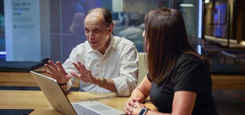 Richard Boscovich, assistant general counsel, DCU, in conversation during a meeting.