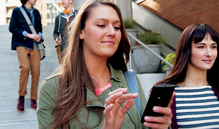 a woman holding a cell phone