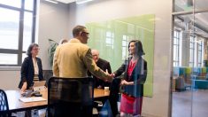 a group of people standing in a room