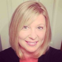 a woman smiling for the camera