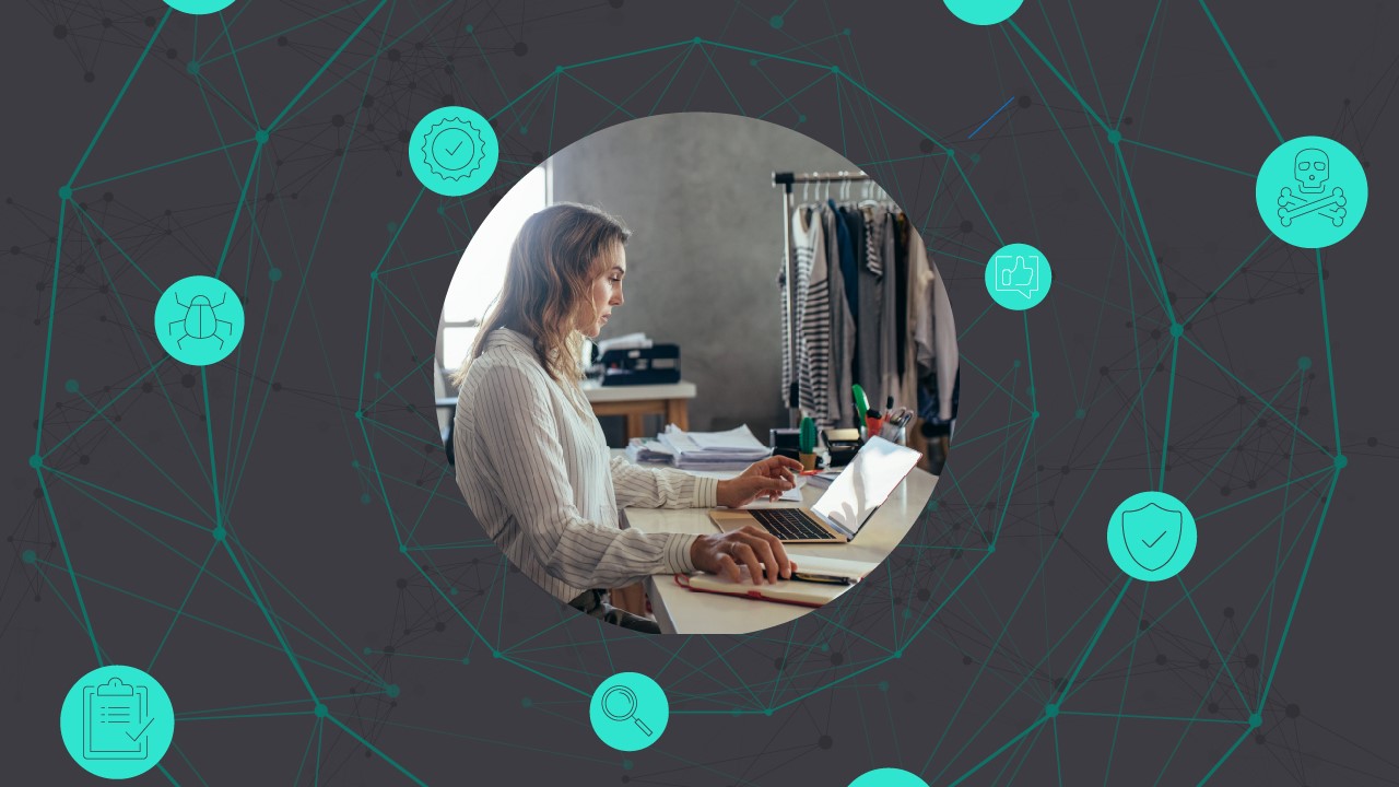 A retail employee working at a Microsoft computer at a clothing store.