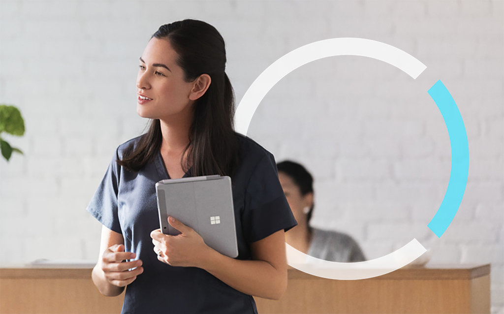 First line worker using Surface Go in medical office. Contextual first line worker.