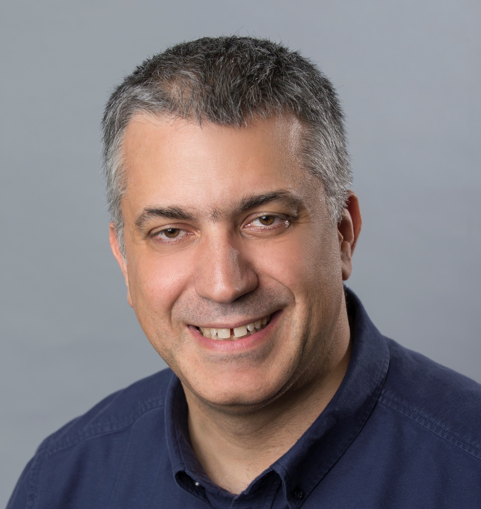 Professional headshot of Gurkan Salk