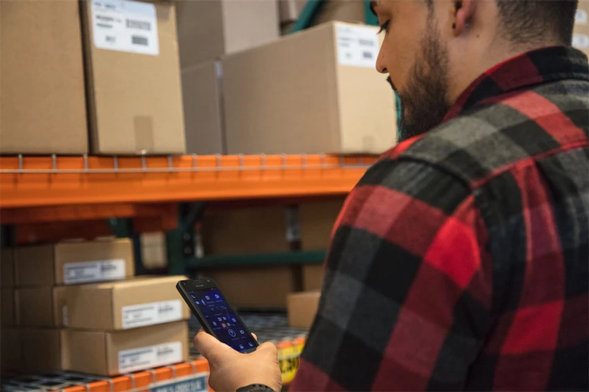 a man standing in front of a computer