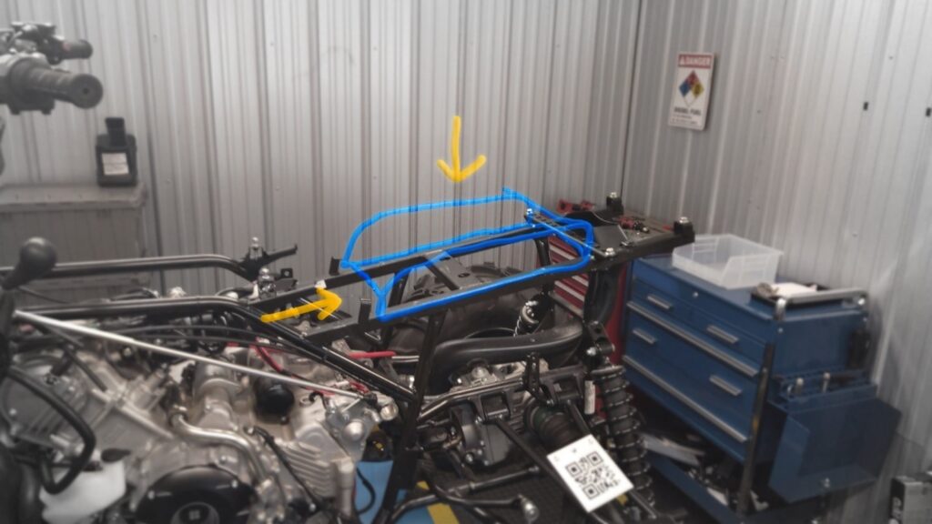 Photo of a machine viewed through HoloLens with digital ink annotations.