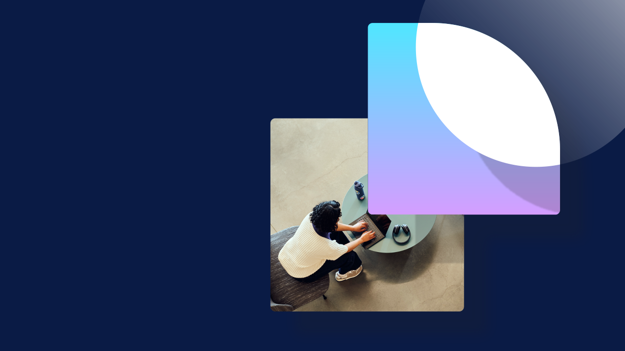 An abstract image of a person sitting at a table using a laptop