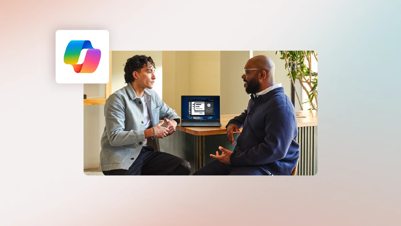 Two finance professionals sitting at a table talking