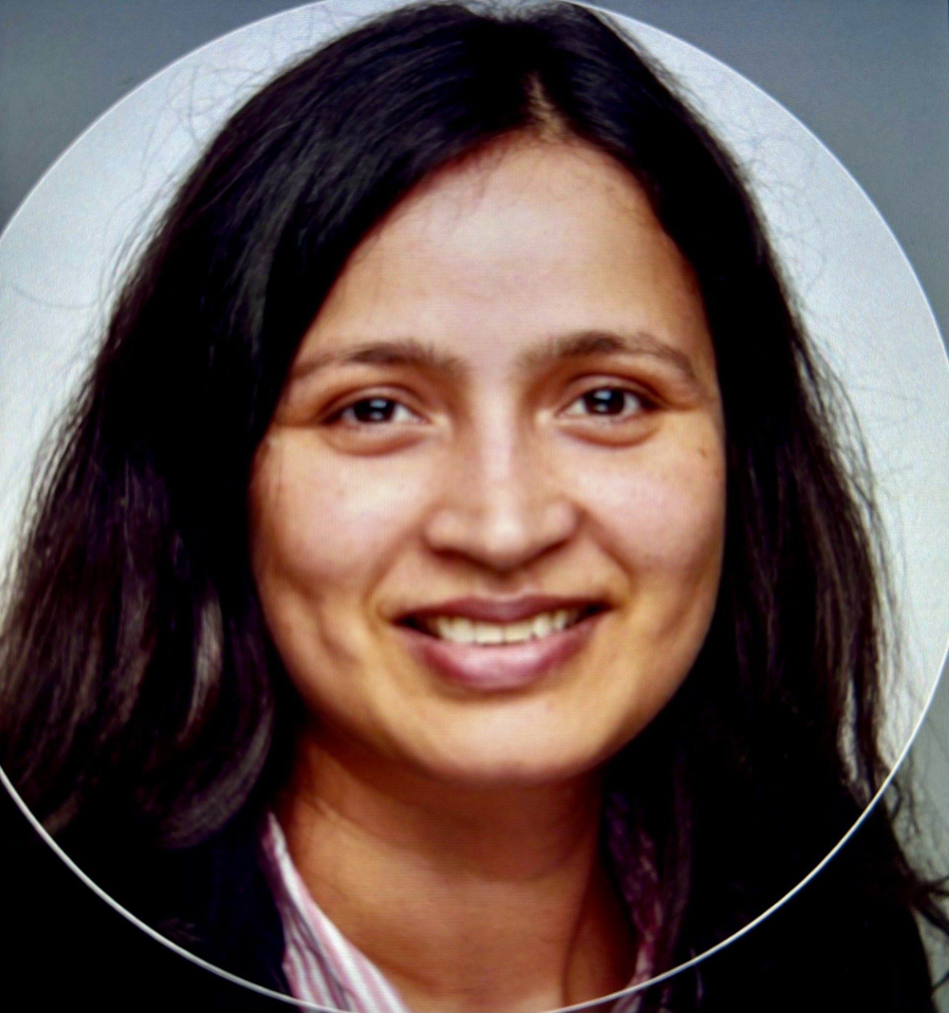 Profile photo of a person with a neutral circular backdrop