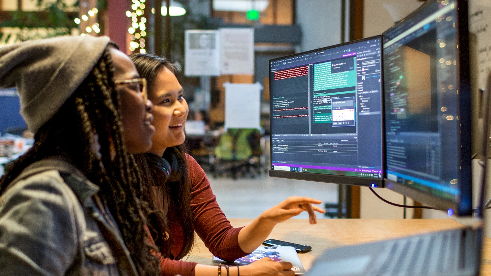 Two students working together on a computer