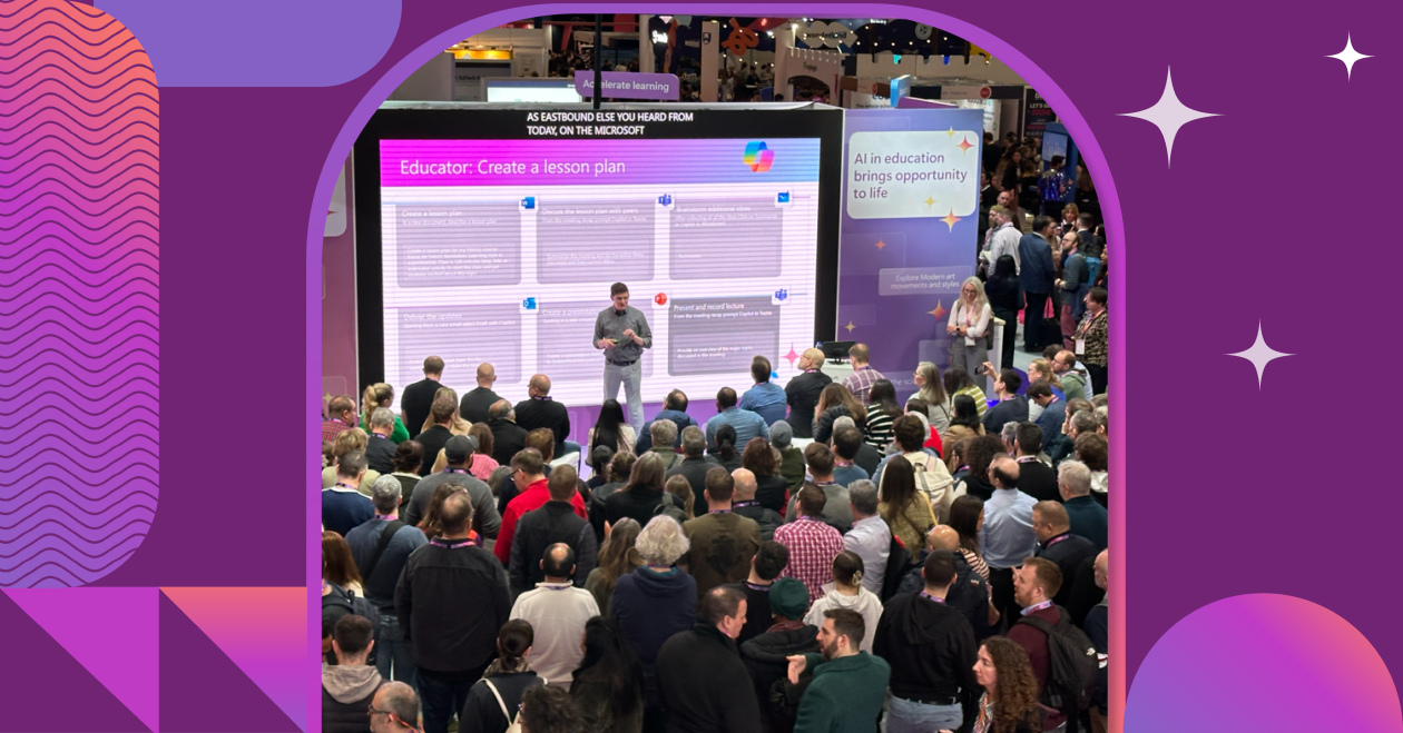 Microsoft booth at Bett UK 2025 with attendees viewing AI-powered product demonstrations.