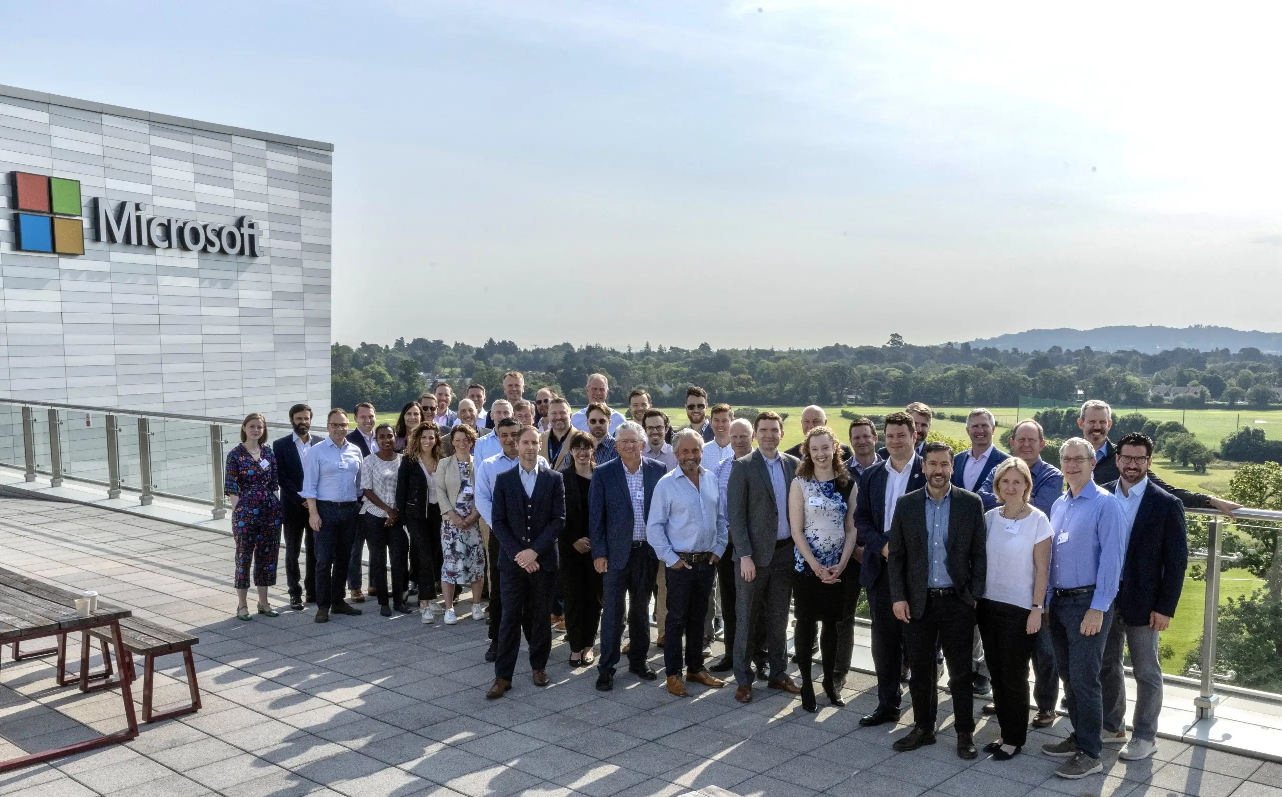 Group photo of the members of the Decarbonization group positing in front of a Microsoft building.