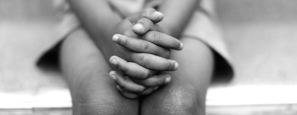 Picture of a young child's hands folded