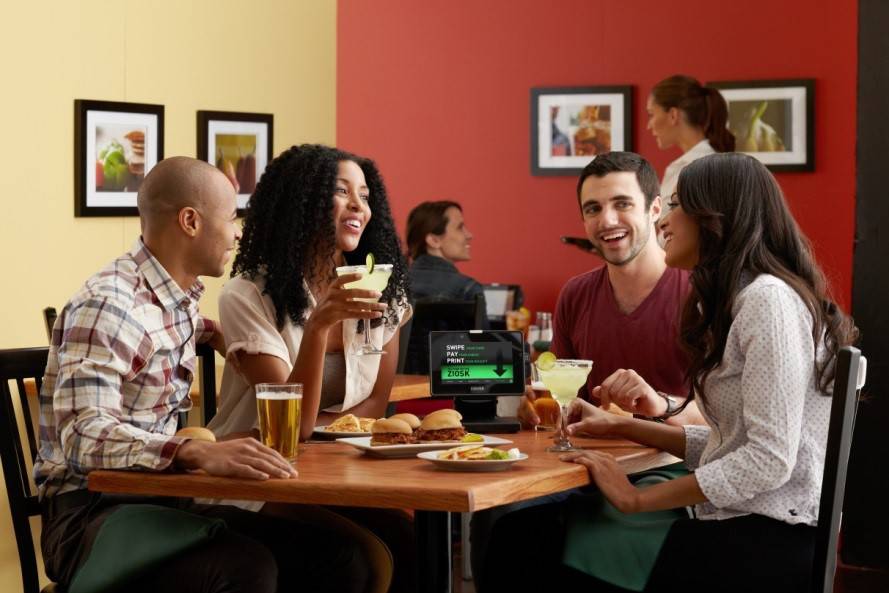 A group of happy peoples eating and discussing
