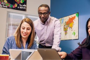 An image of a group working on laptops.