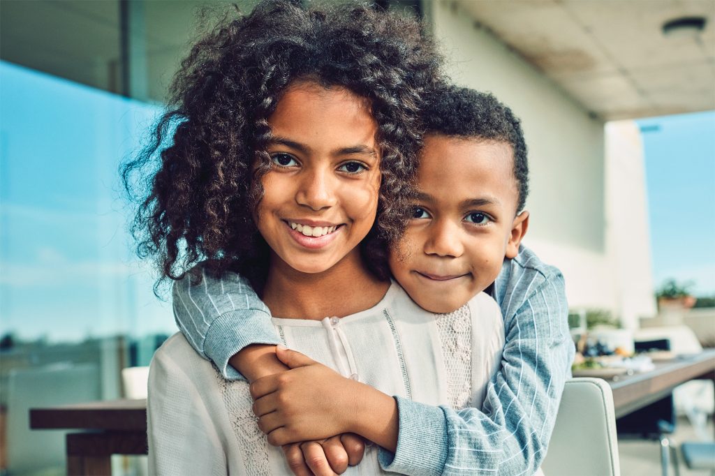 Two children smiling