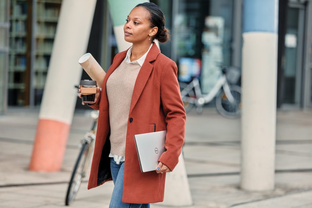 Woman with computer in city