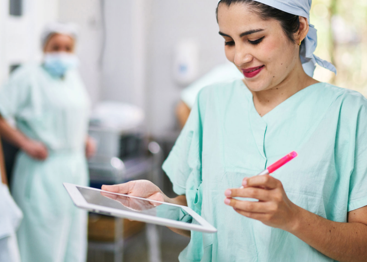 Healthcare employee working with device