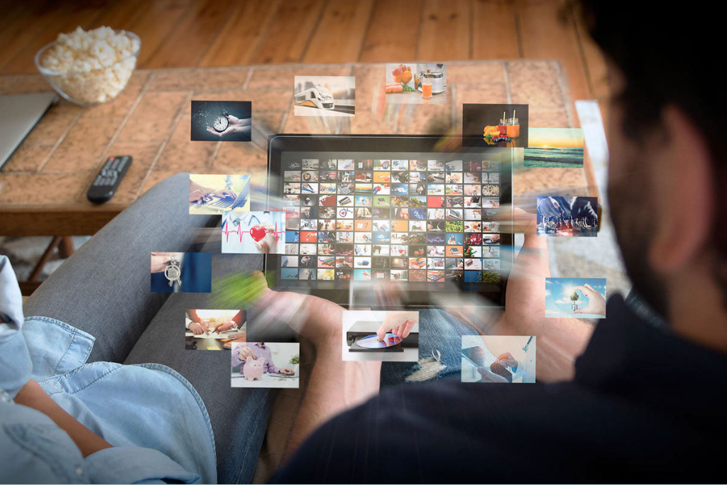 people looking at multiple 3d screens