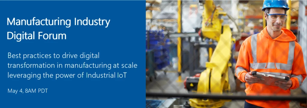 two people in a factory wearing helmets