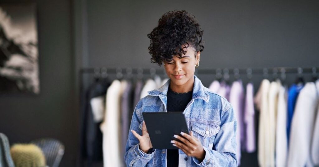 A woman holding a tablet