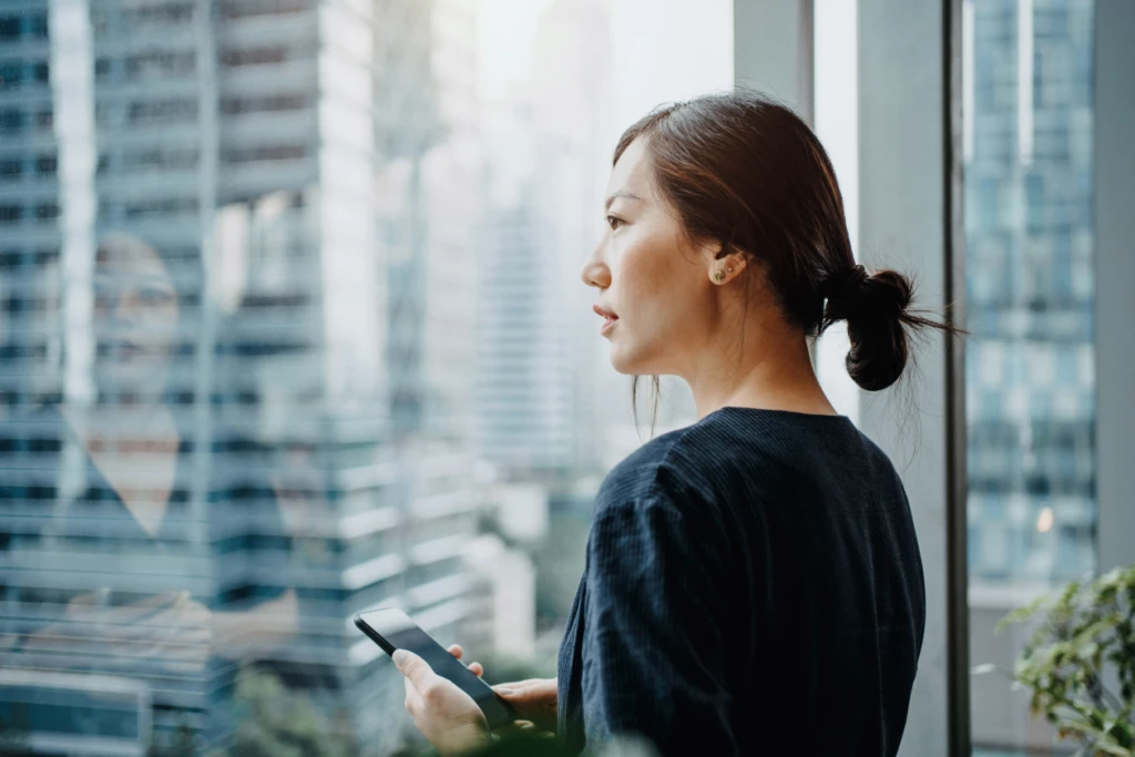 A woman looking out a window