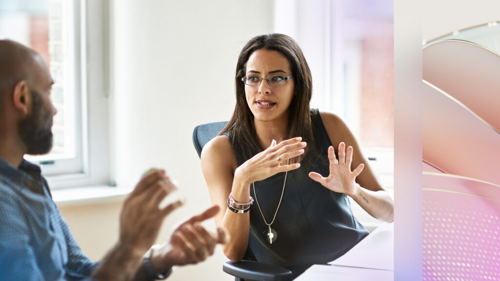 A decorative image of two financial services professionals working together