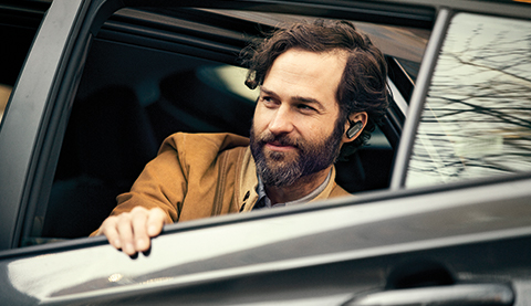 A man sitting in a car