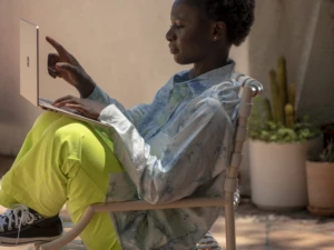 A woman shopping online. Fraud protection can help improve customer journeys