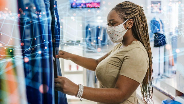 Women in a mask, shopping for curtains.