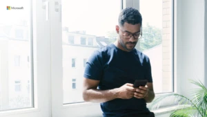man looking down at his phone