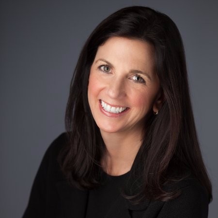 A woman smiling at the camera