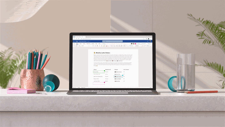 Animated image of a laptop morphing into a desktop PC, followed by a number of Office app screens appearing, illustrating the power of the Fluid Framework.