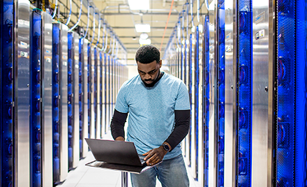 Image of an IT professional in a datacenter.