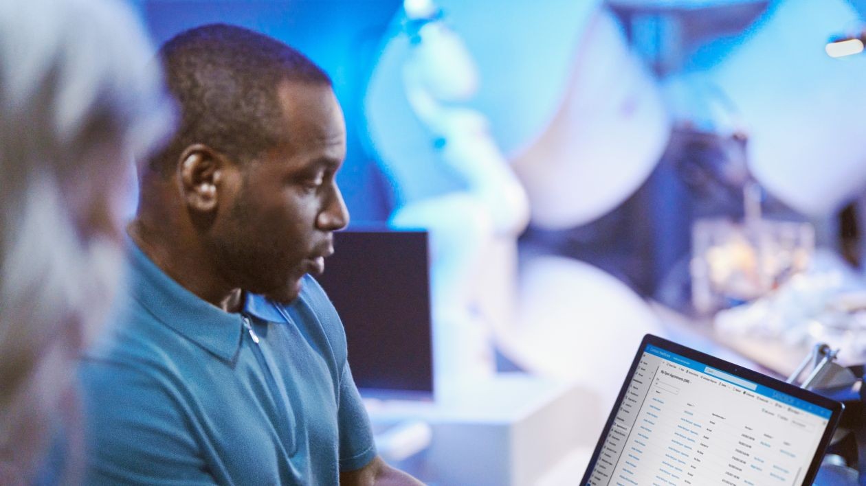 In a healthcare setting, researchers collaborate in a medical treatment room.