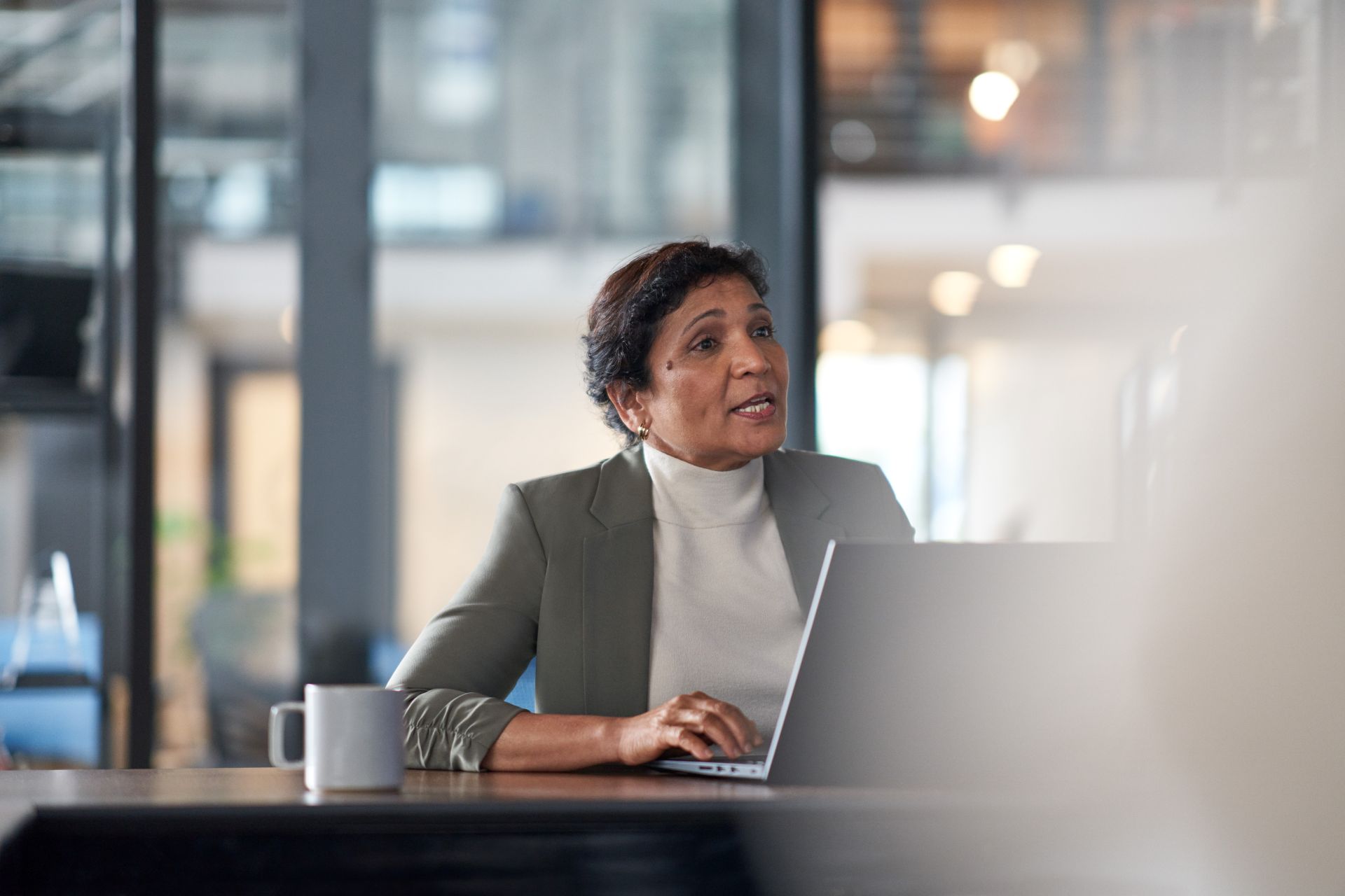 Person sitting at a desk in front of a computer