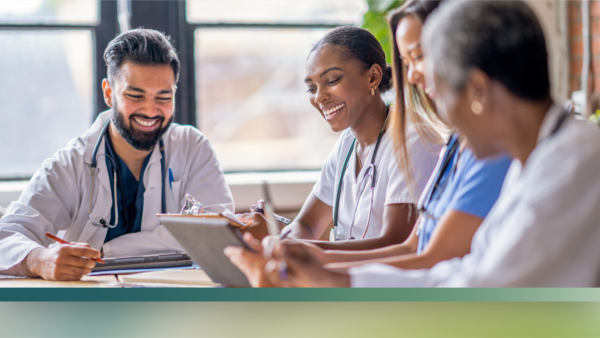 A decorative image of three healthcare workers collaborating