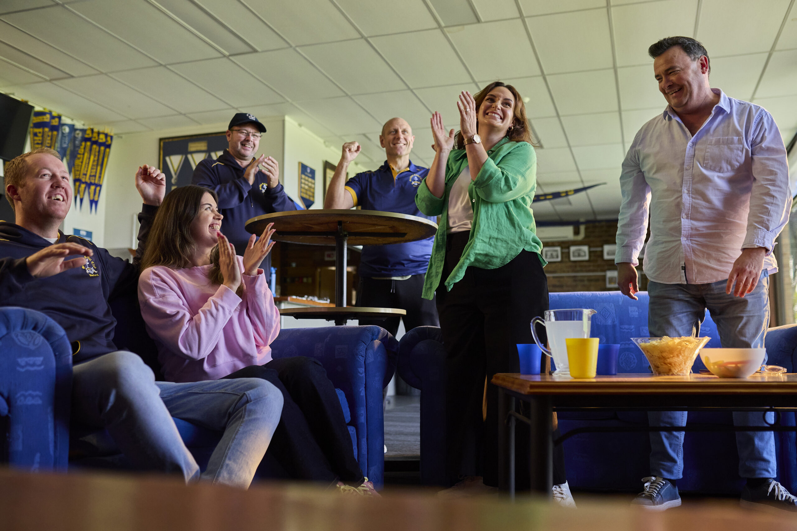 Cricket fans cheer for their team.