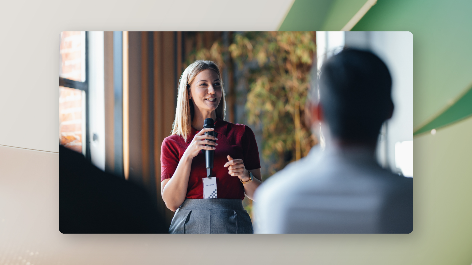 Abstract image with an image of speaker in front of audience