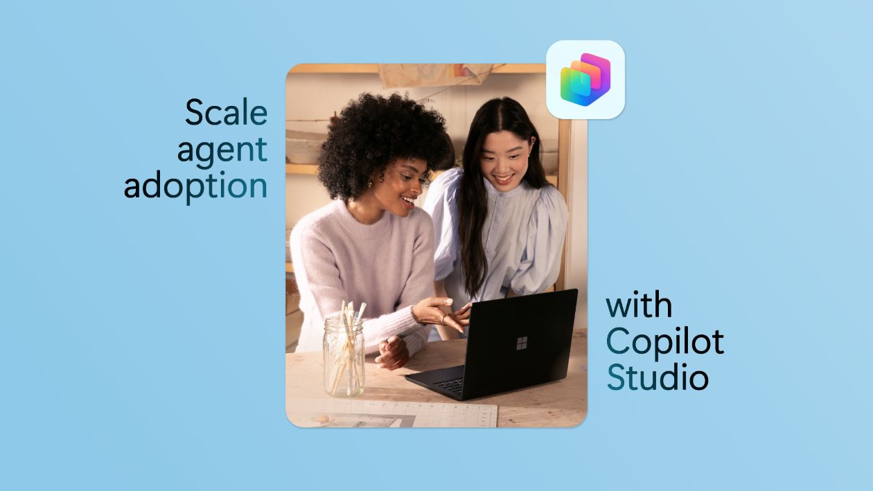 Two business professionals looking at the screen of a laptop and collaborating