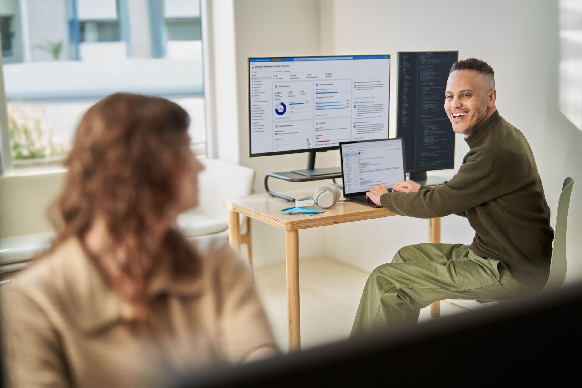 A man sitting at a desk with a computer